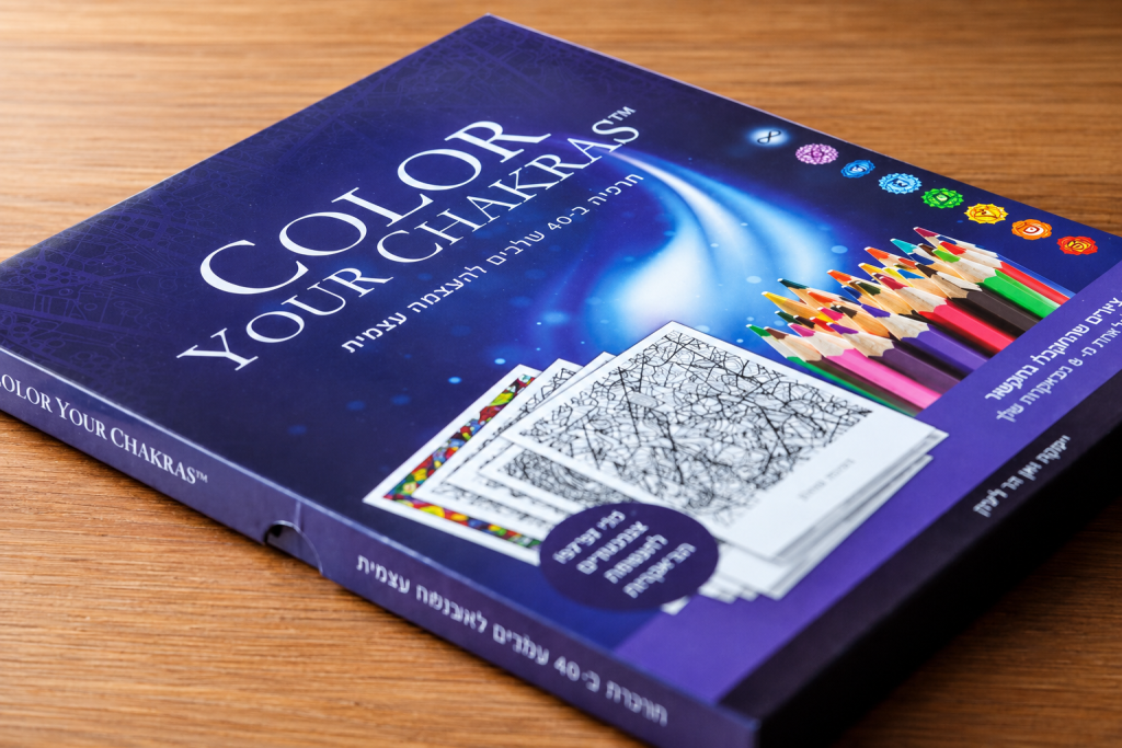 Color Your Chakras box shown on a wooden table